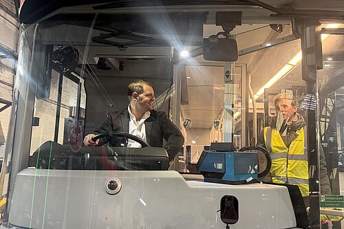 Luke at a bus garage
